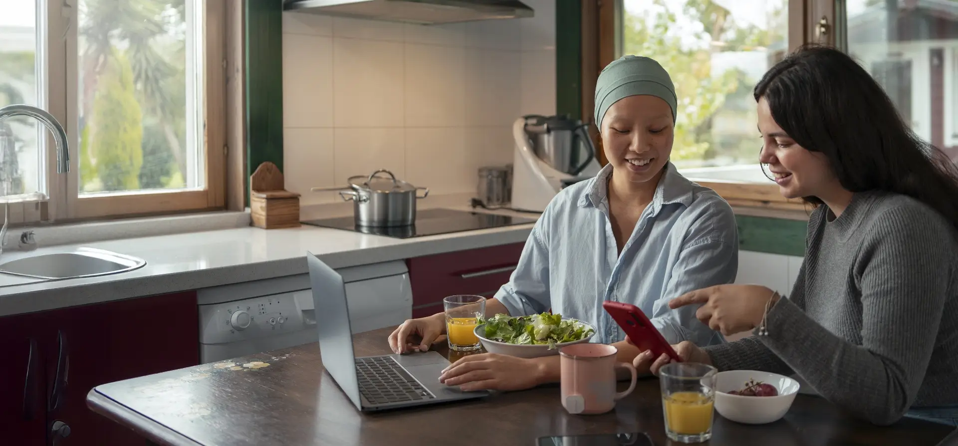 Portrait Woman With Cancer Using Laptop With Friend Home